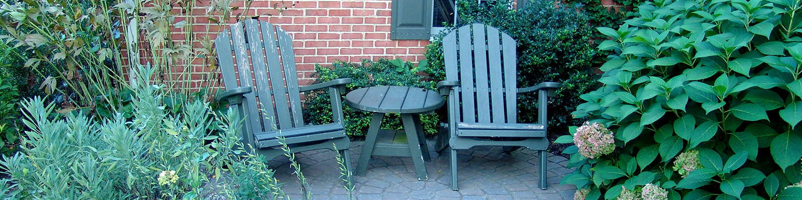 Outdoor chairs on landscaped patio